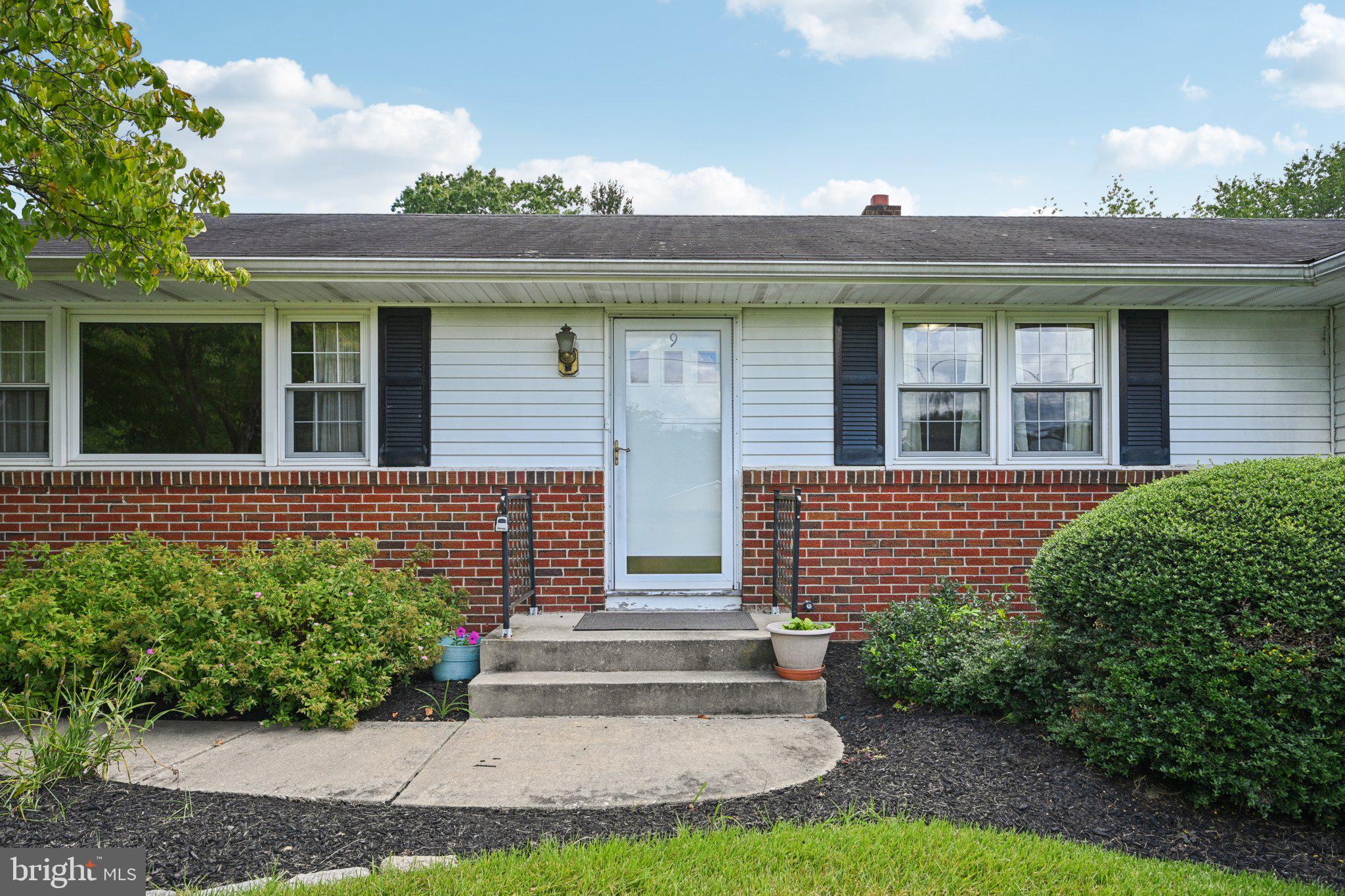 9 Cooper Tomlinson Road Medford, NJ 08055 - Photo 4 of 39 a front view of a house with a yard