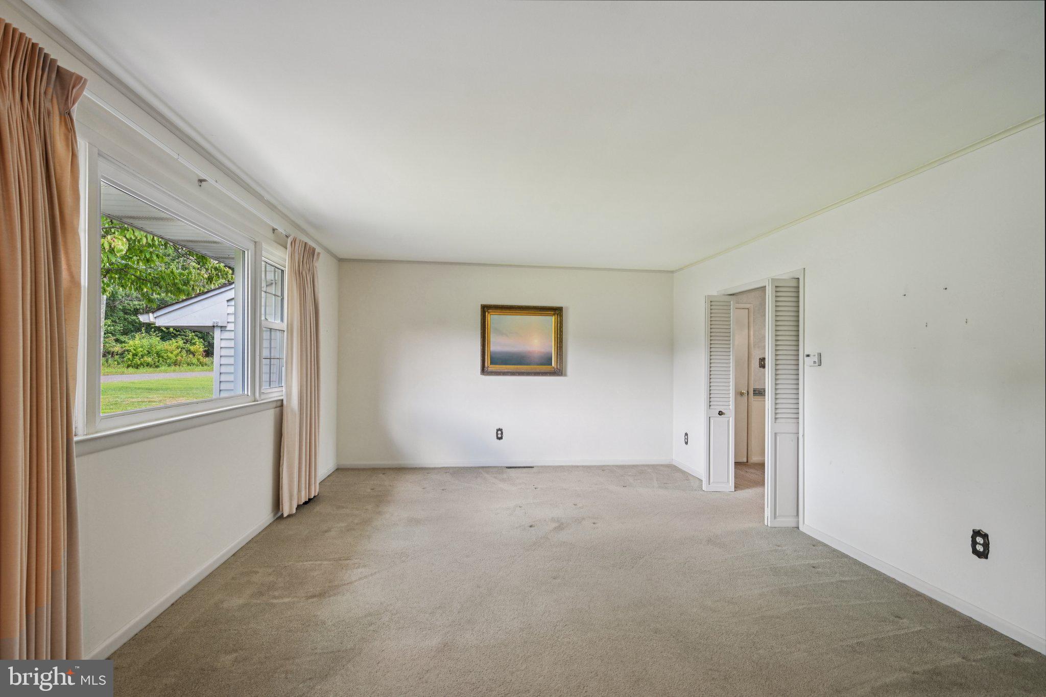 9 Cooper Tomlinson Road Medford, NJ 08055 - Photo 6 of 39 an empty room with a window