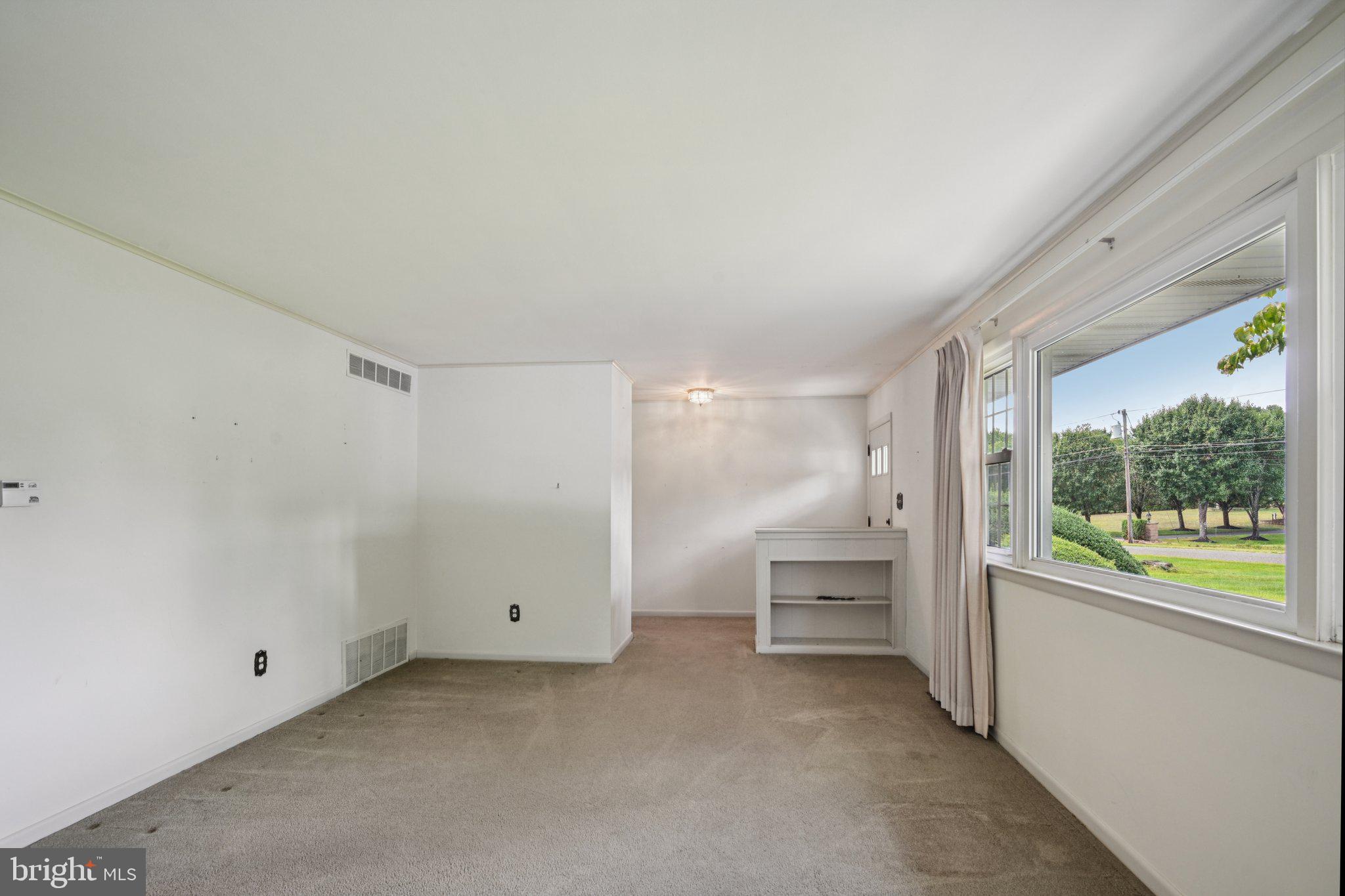9 Cooper Tomlinson Road Medford, NJ 08055 - Photo 8 of 39 a view of an empty room with a window