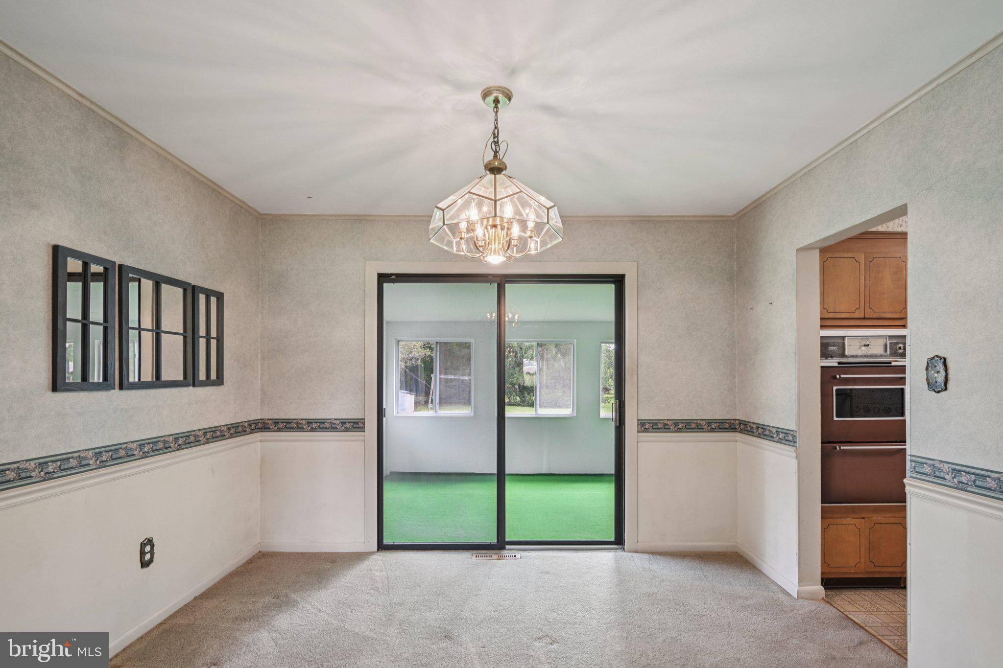 9 Cooper Tomlinson Road Medford, NJ 08055 - Photo 9 of 39 a view of a hallway with a chandelier