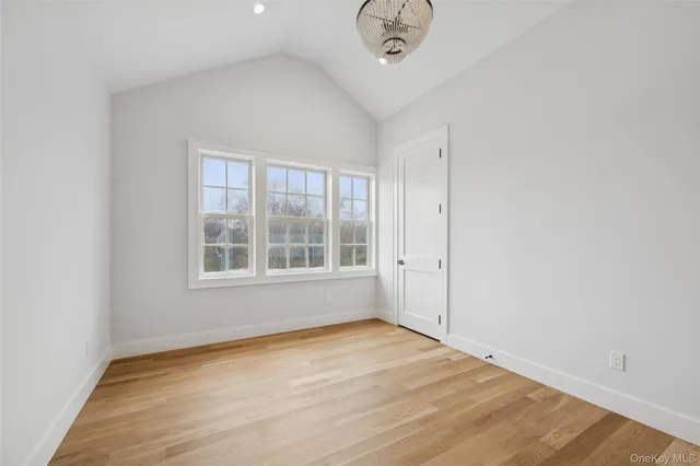 an empty room with a empty space and windows