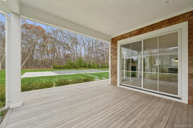 a view of outdoor space with wooden floor and yard