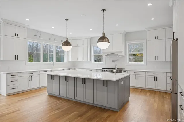 a large kitchen with a lot of counter space and a sink