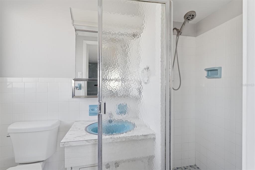 7608 Redcoat Avenue Port Richey, FL 34668 - Photo 19 of 28 a bathroom with a sink toilet and shower