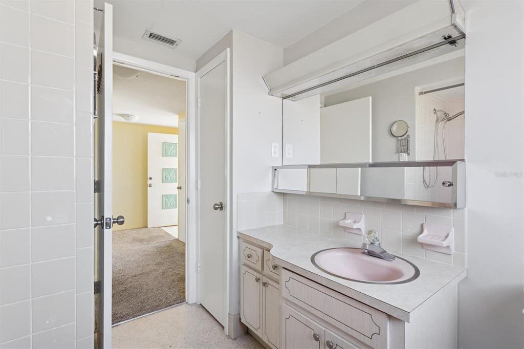 7608 Redcoat Avenue Port Richey, FL 34668 - Photo 21 of 28 a bathroom with a sink and a mirror