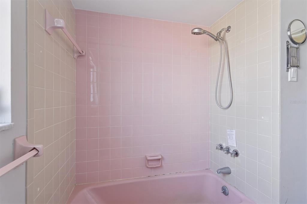 7608 Redcoat Avenue Port Richey, FL 34668 - Photo 22 of 28 a bathroom with a bath tub with a shower