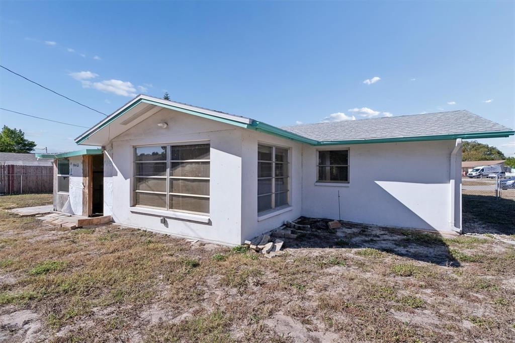 7608 Redcoat Avenue Port Richey, FL 34668 - Photo 27 of 28 a front view of a house with a yard