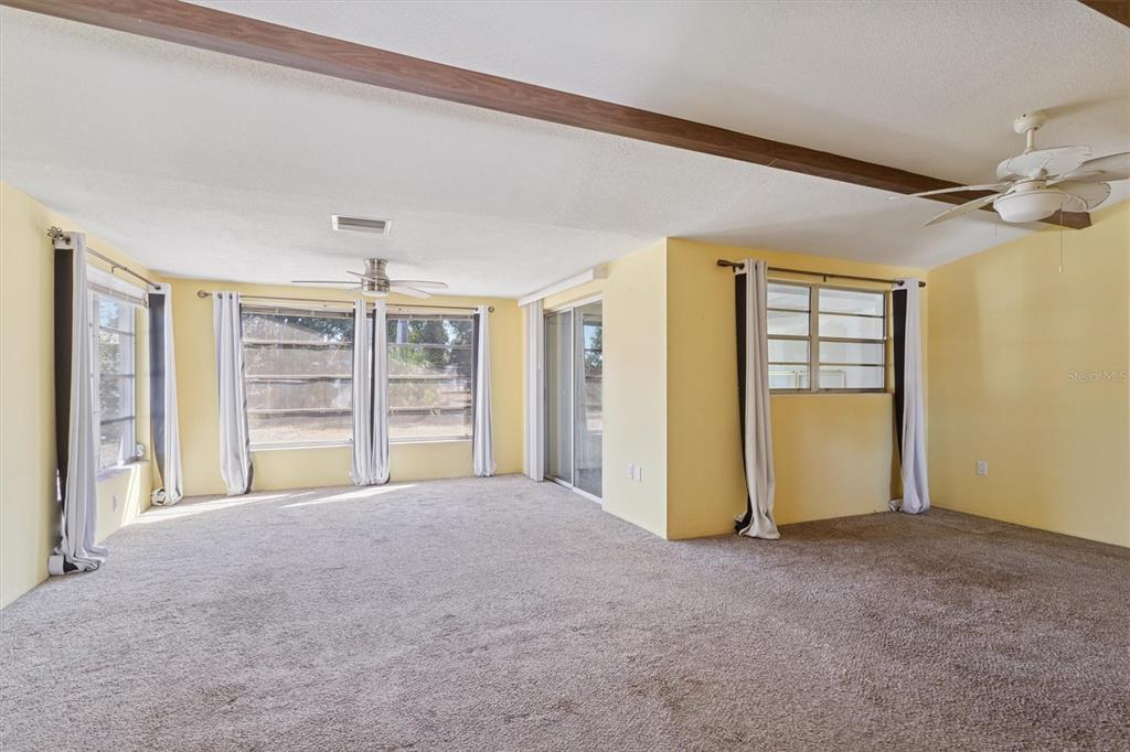 7608 Redcoat Avenue Port Richey, FL 34668 - Photo 7 of 28 a view of an empty room with a window