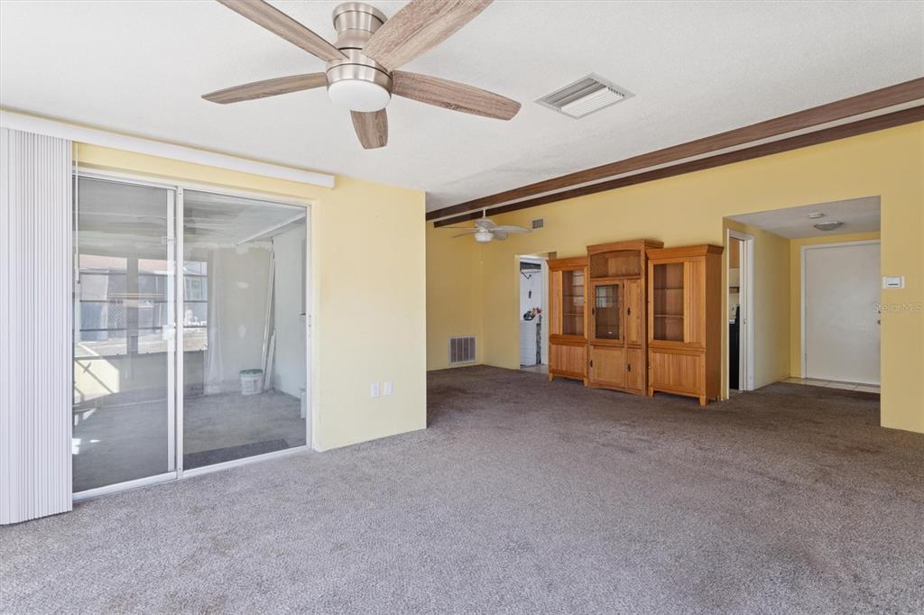 7608 Redcoat Avenue Port Richey, FL 34668 - Photo 9 of 28 an empty room with closet and windows