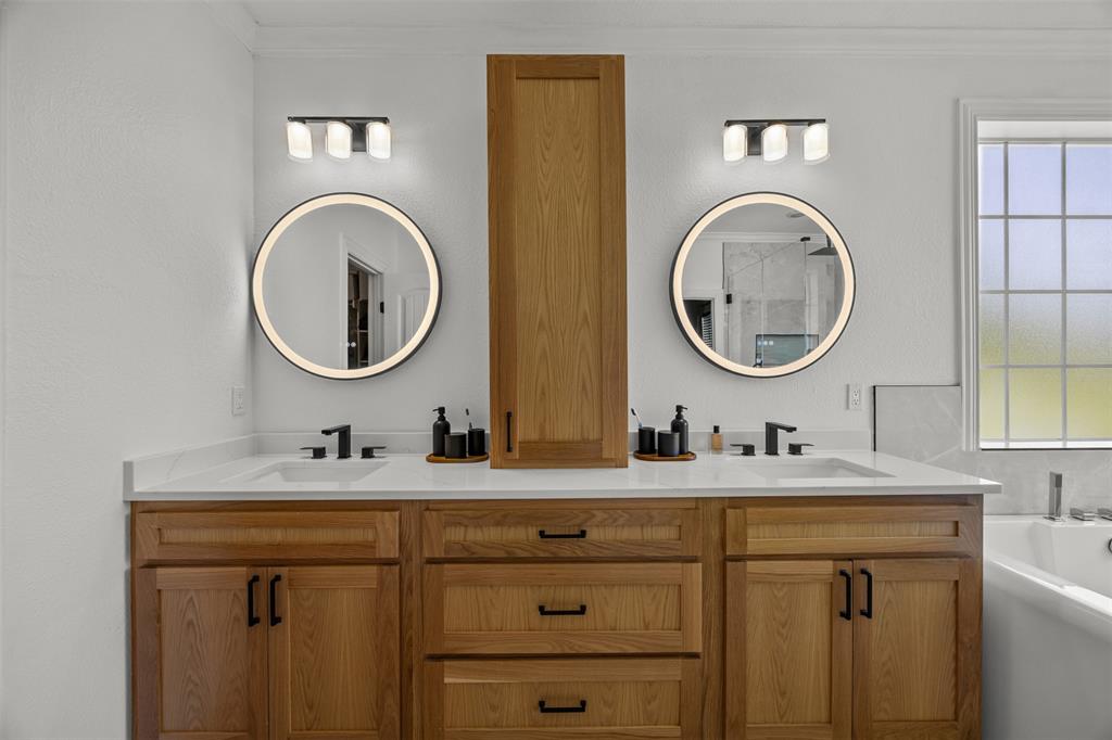 3175 Collins Road Burleson, TX 76028 - Photo 24 of 40 a bathroom with a double vanity sink and a mirror