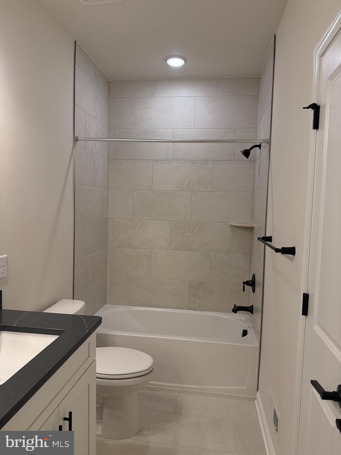 603 Parker Boulevard Princeton Junction, NJ 08540 - Photo 4 of 7 a bathroom with a granite countertop sink toilet and shower