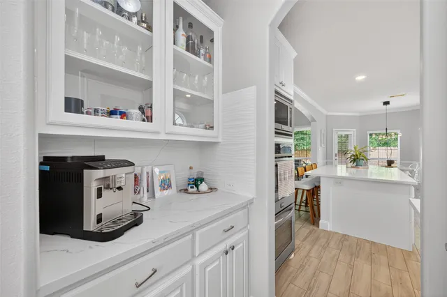 a kitchen with cabinets and window