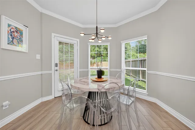 a view of a dining room with furniture window and outside view
