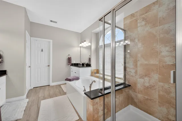 a living room with a floor to ceiling window and a rug