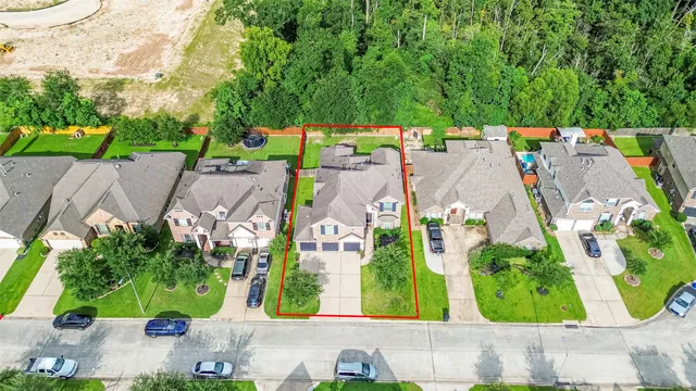 an aerial view of residential house with outdoor space