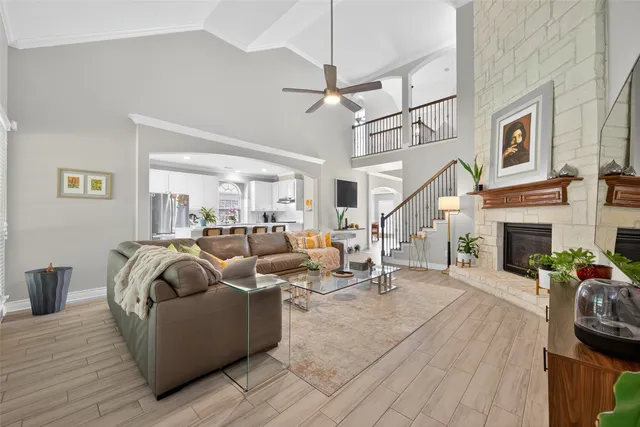 a living room with furniture and a fireplace