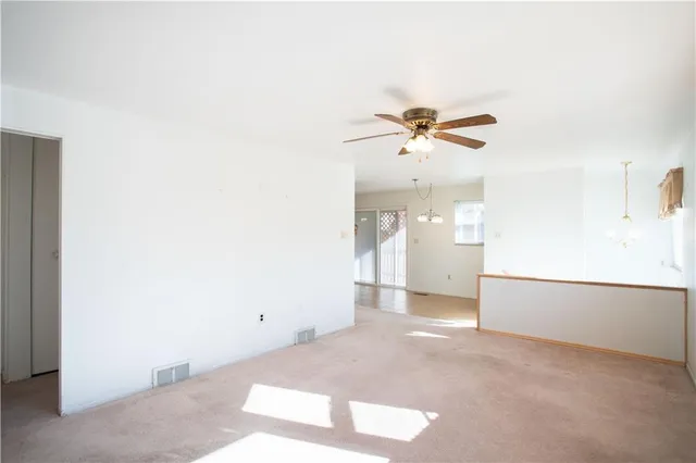 a view of a workspace with a ceiling fan