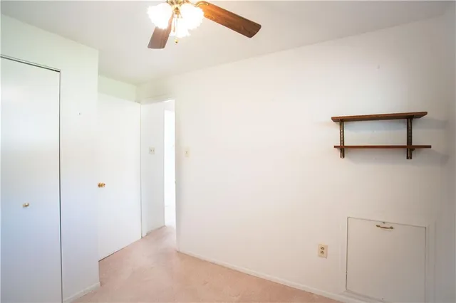 a view of a hallway with closet