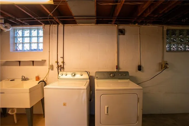 a bathroom with a shower and a sink