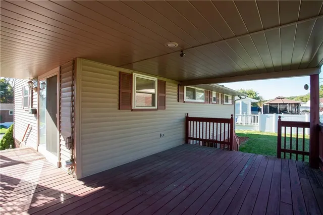 a view of a porch with wooden floor