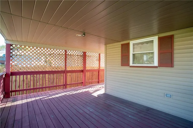 a view of a porch with wooden floor