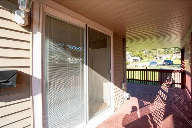 a view of a house with a yard porch and sitting area