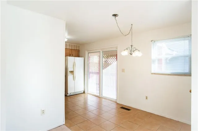 a view of a room with a windows and cabinet