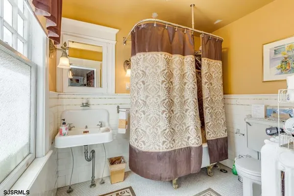 a bedroom with a bed and a walk in closet