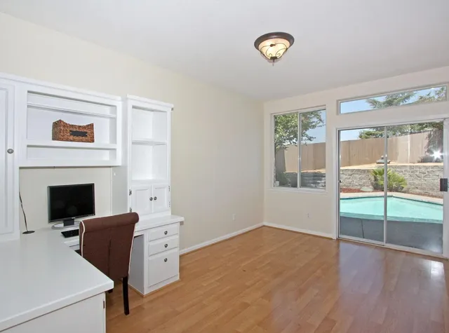 a view of a livingroom with furniture and a fireplace
