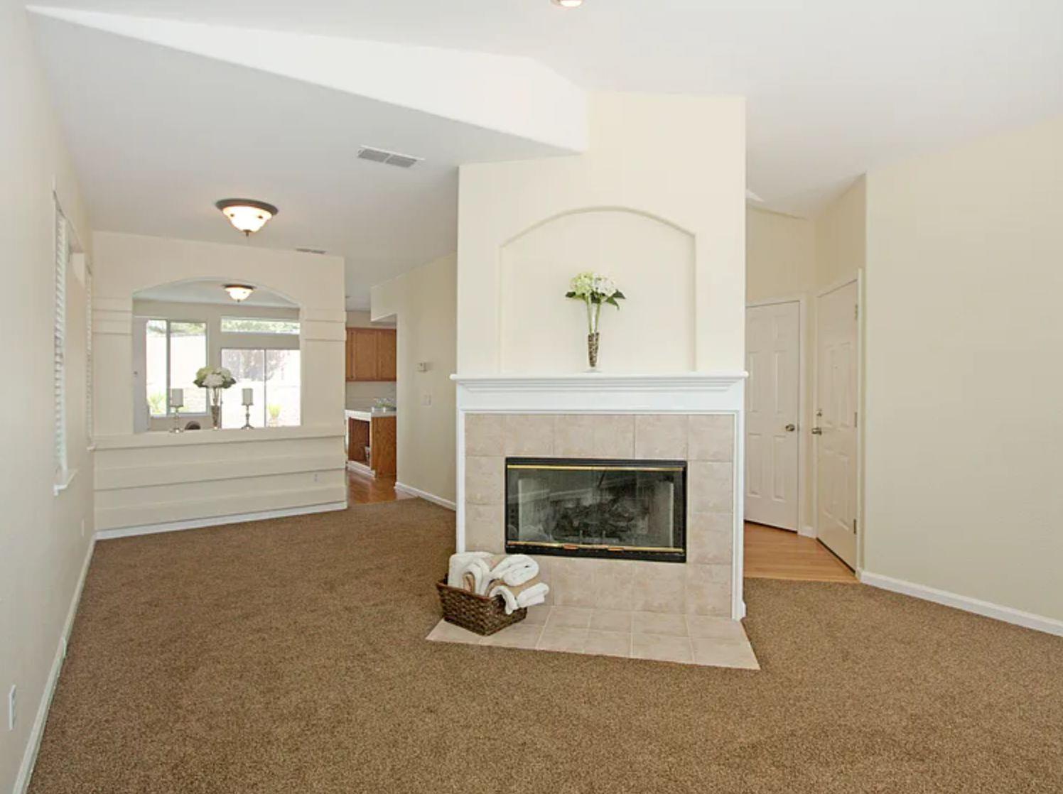 8210 Deer Spring Circle Antelope, CA 95843 - Photo 5 of 6 a living room with furniture and a fireplace