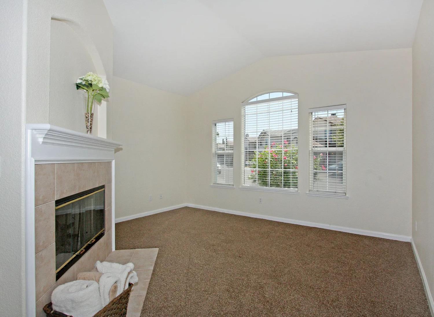 8210 Deer Spring Circle Antelope, CA 95843 - Photo 6 of 6 a living room with furniture and a fireplace
