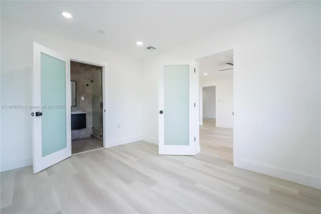 a view of entryway with wooden floor