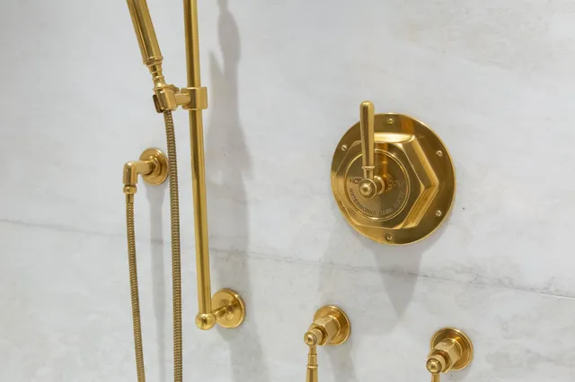 a bathroom with a double vanity sink mirror and toilet