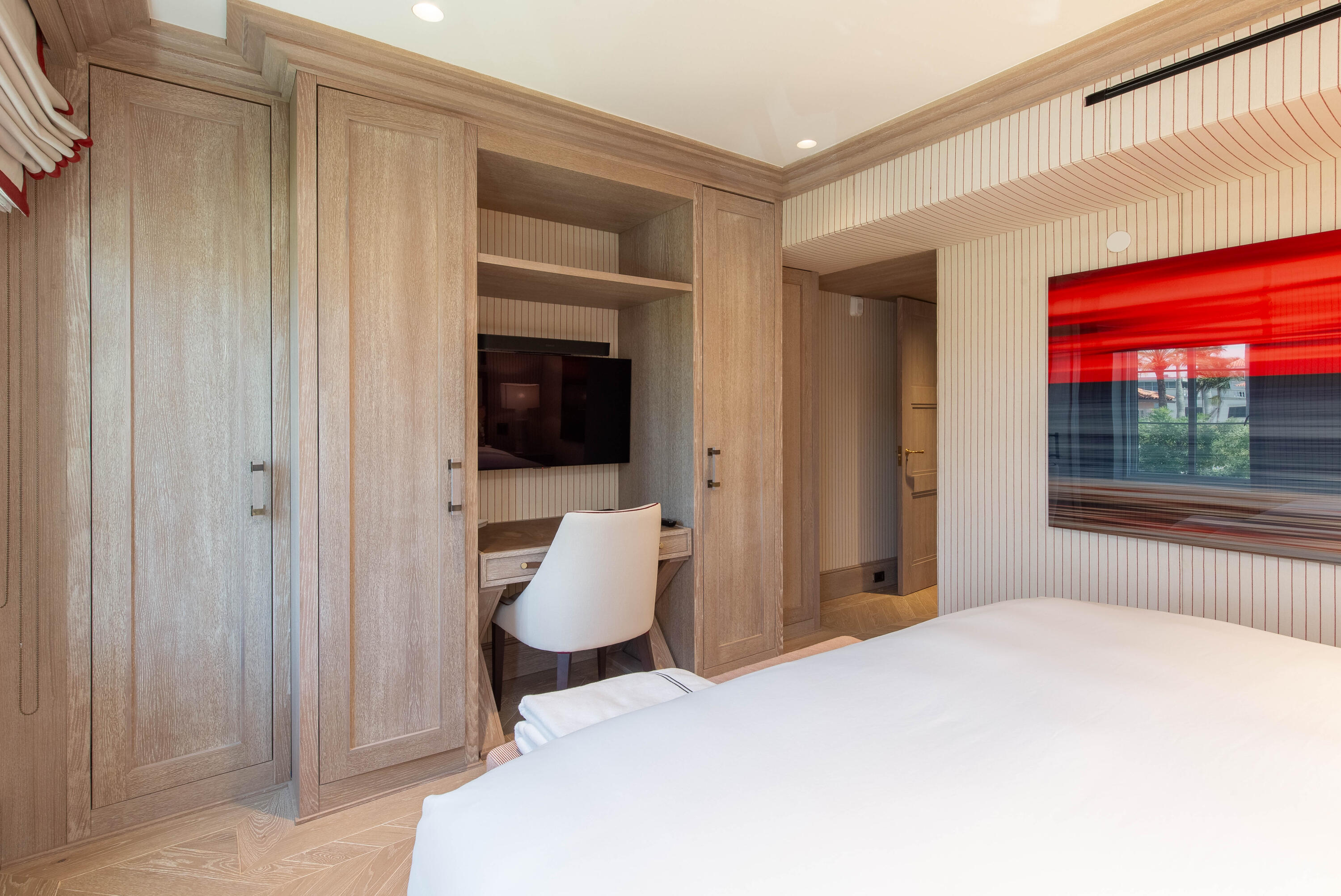 236 Phipps Plaza, Unit D Palm Beach, FL 33480 - Photo 34 of 55 a bedroom with a bed and a window