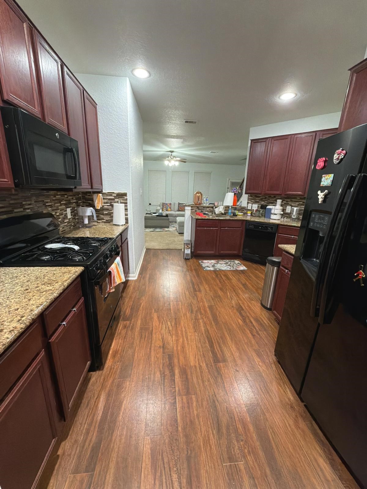 2623 Hunters Side Trail Fresno, TX 77545 - Photo 11 of 12 a kitchen with wooden floors and a stove