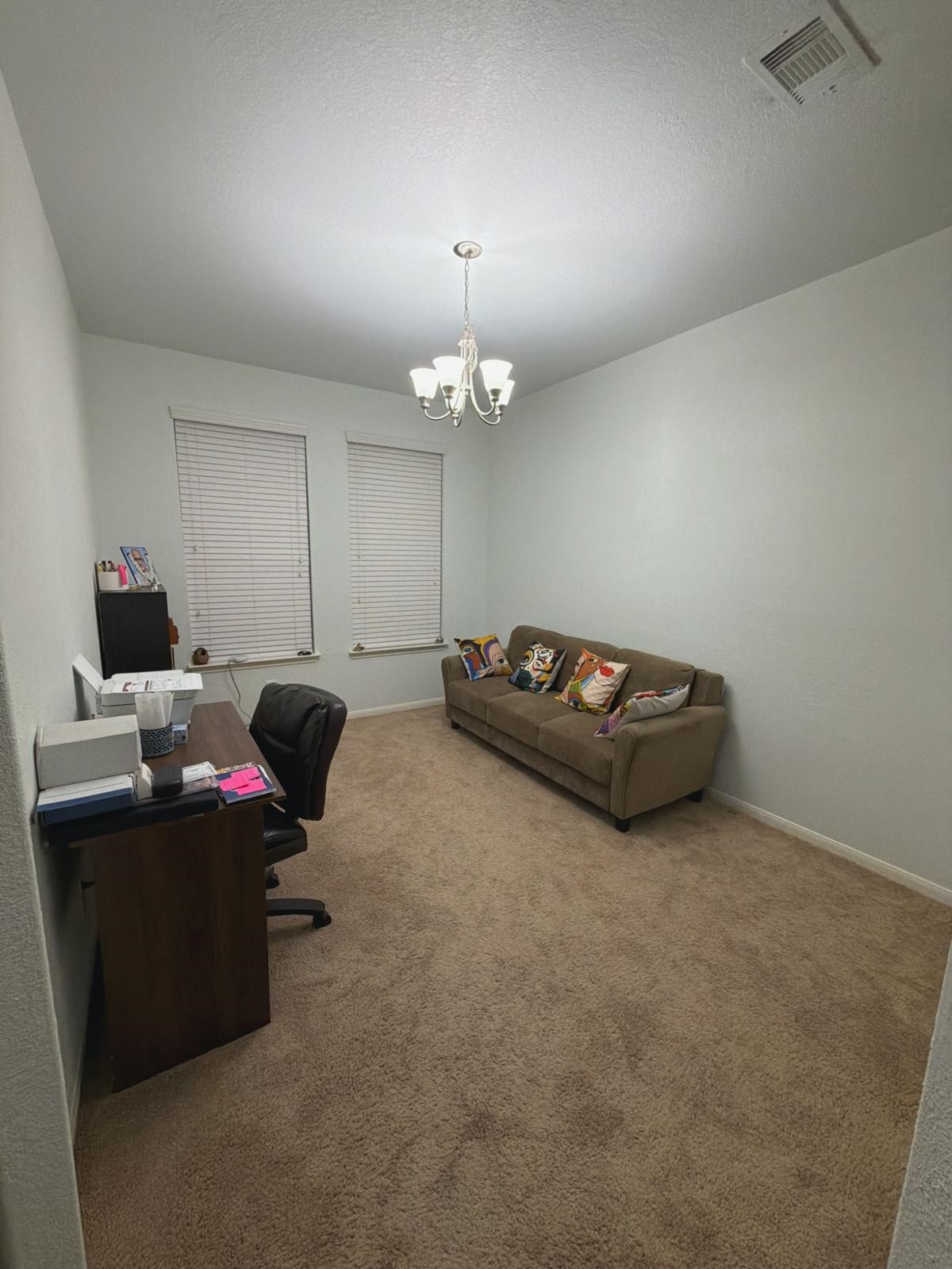 2623 Hunters Side Trail Fresno, TX 77545 - Photo 12 of 12 a living room with furniture and a chandelier