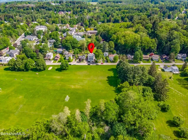 a view of a park with large trees