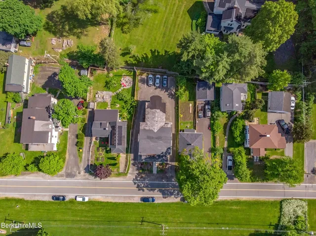 an aerial view of a house with a garden