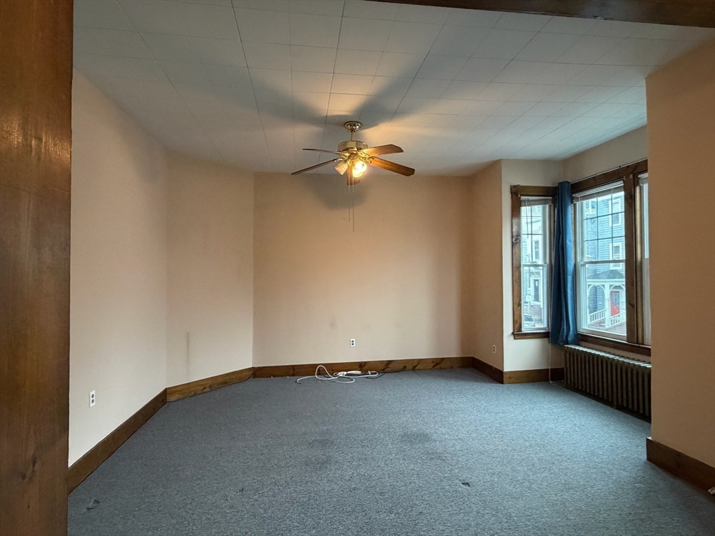 628 East 3rd Street, Unit 2 Boston, MA 02127 - Photo 12 of 21 an empty room with windows and fan