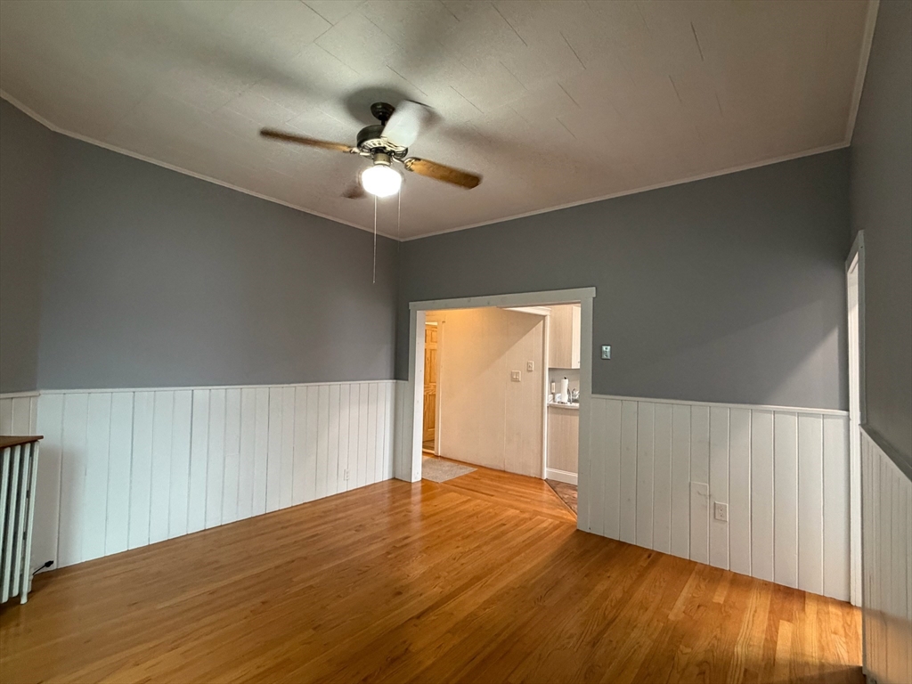 628 East 3rd Street, Unit 2 Boston, MA 02127 - Photo 21 of 21 a view of an empty room with wooden floor and a ceiling fan