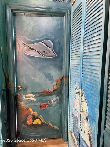 a bedroom with a bed and a night stand