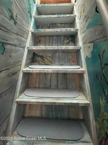 a bathroom with a tub shower sink vanity and a toilet