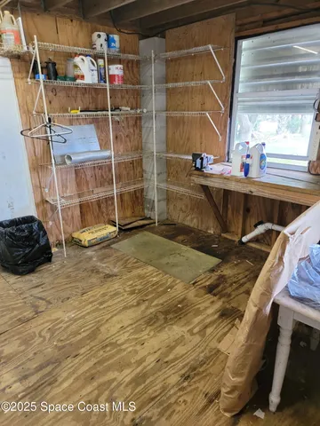 a white toilet sitting next to a window