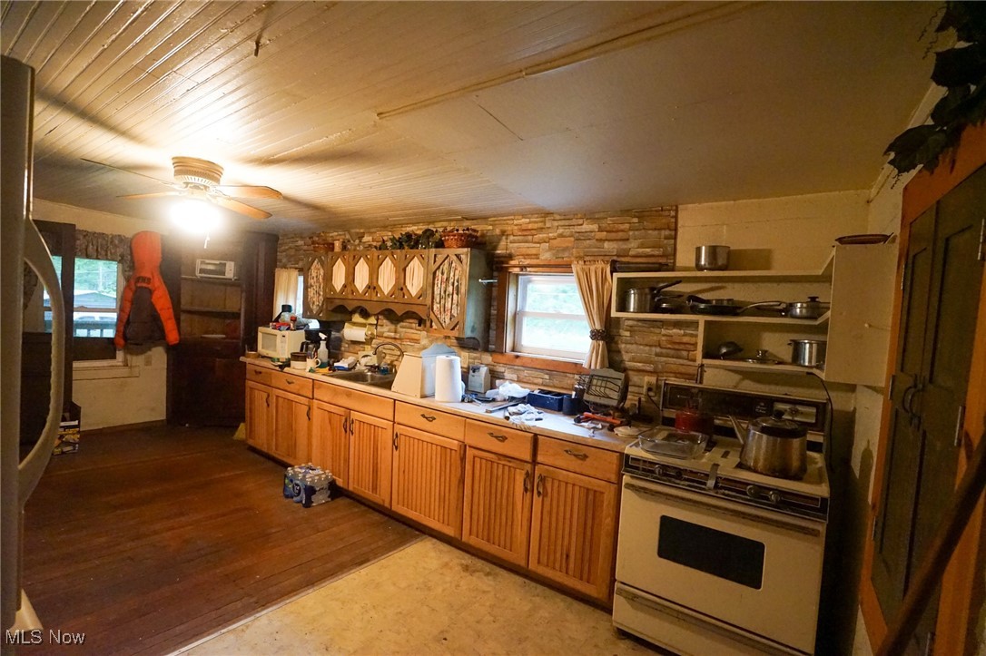 34799 Paw Road Lower Salem, OH 45745 - Photo 6 of 50 Kitchen featuring white appliances, light countertops, open shelves, dark wood finished floors, and a ceiling fan