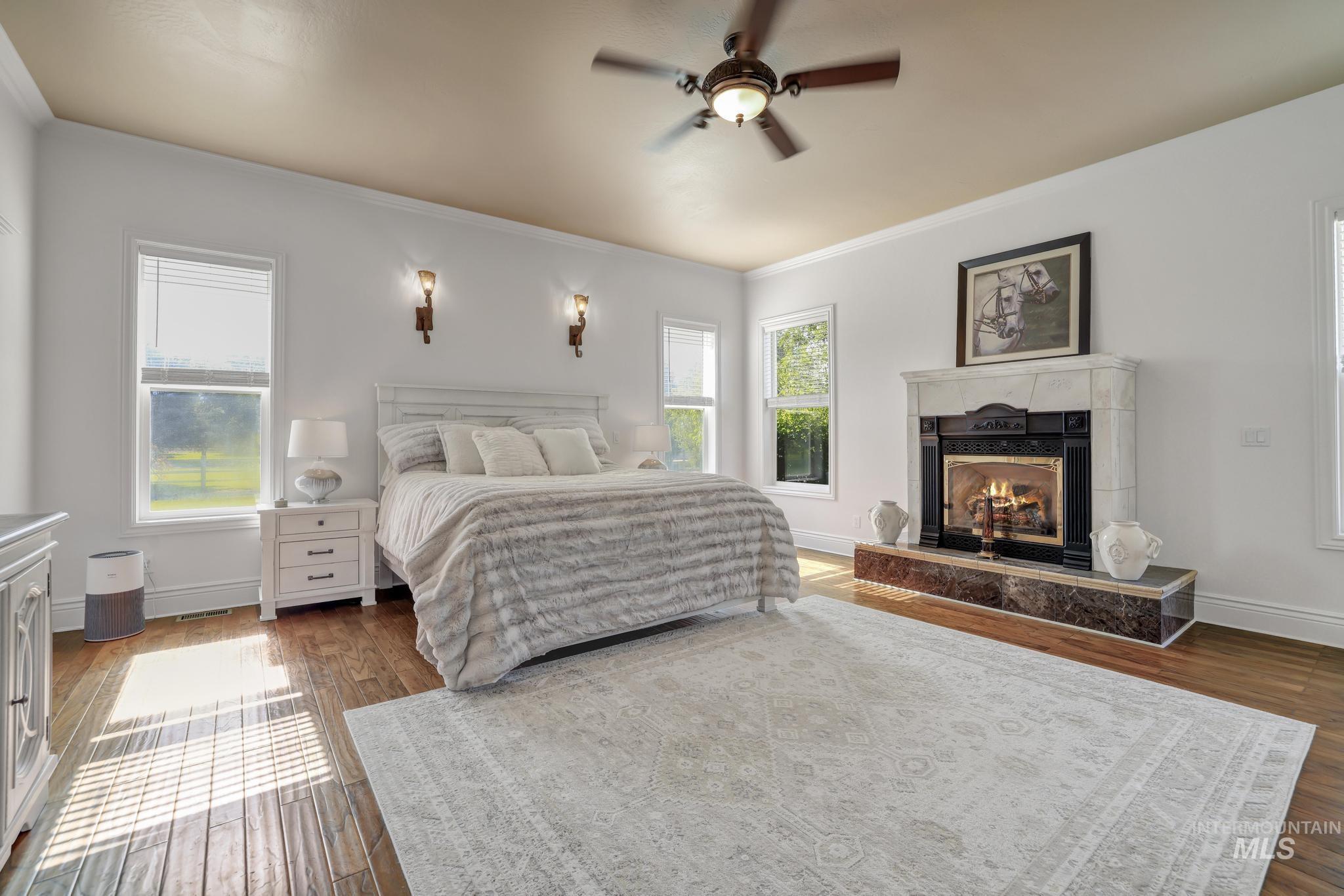 1301 Kanaka Rapids Road Buhl, ID 83316 - Photo 18 of 50 Spacious room featuring wood-finish flooring, a ceiling fan, and multiple windows