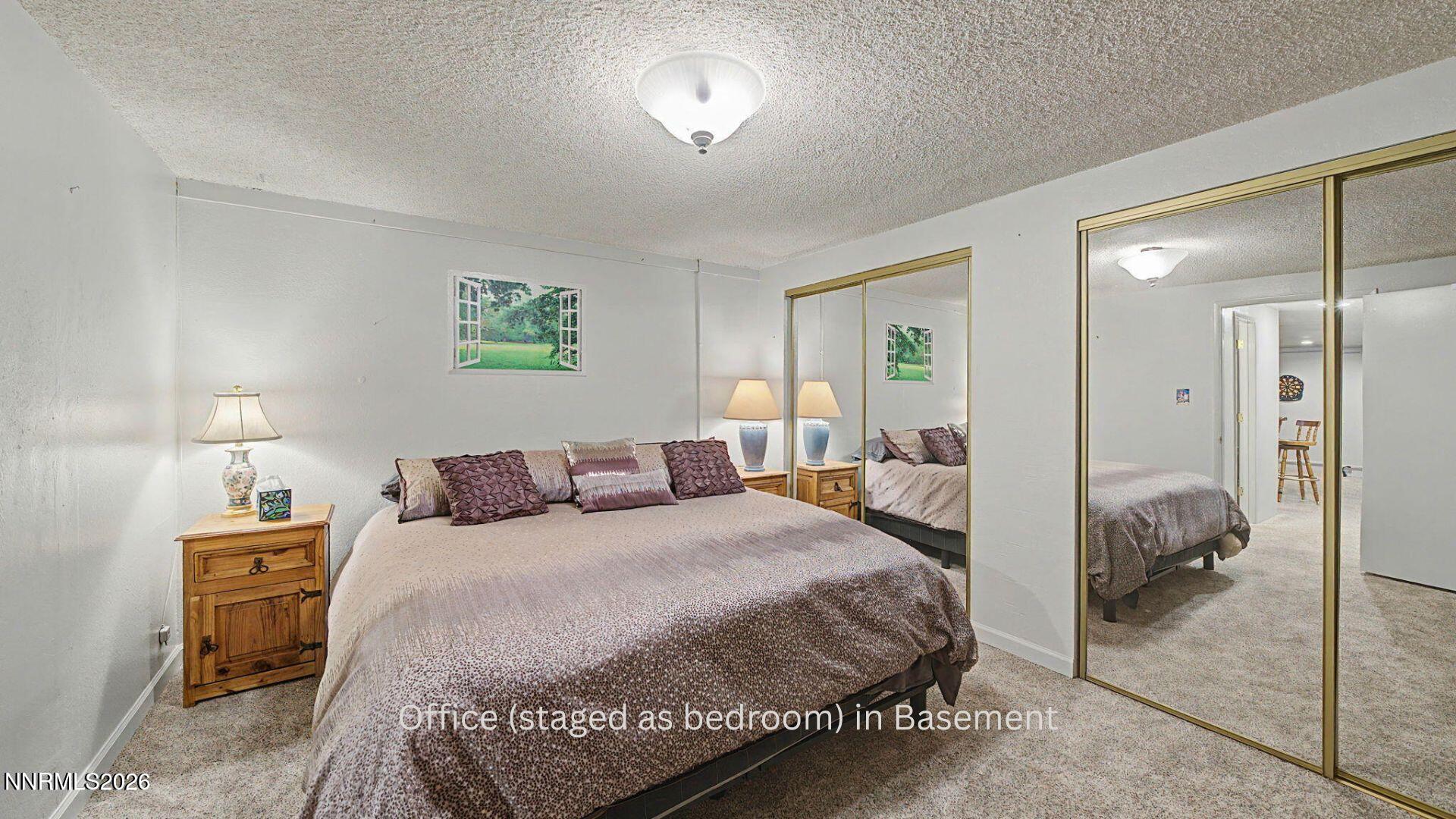 4920 Plumas Street Reno, NV 89509 - Photo 25 of 36 a bedroom with a bed and a walk in closet