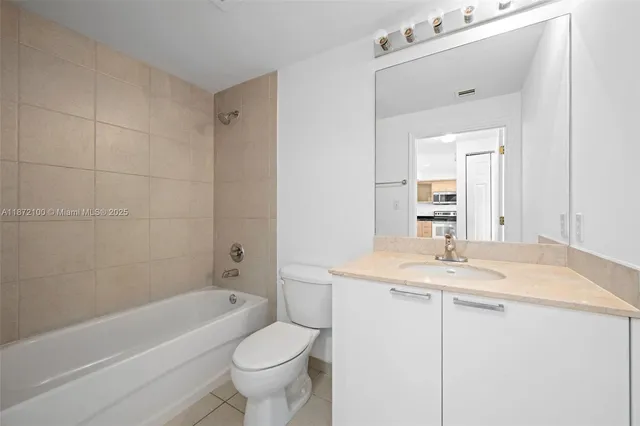 a bathroom with a sink a toilet and bathtub