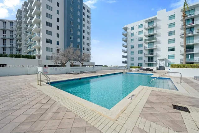 a view of pool with outdoor seating