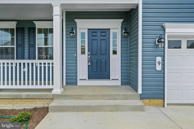 a front view of a house with a garage