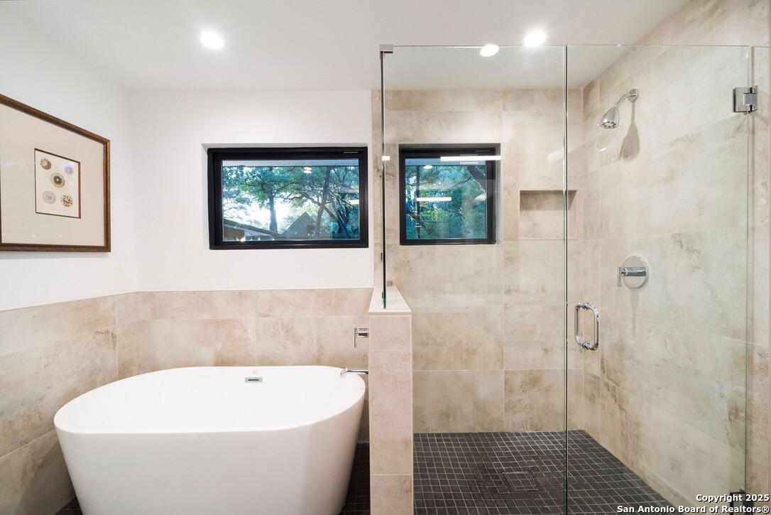 8900 Point W Drive Austin, TX 78759 - Photo 11 of 29 a bathroom with a bathtub and shower